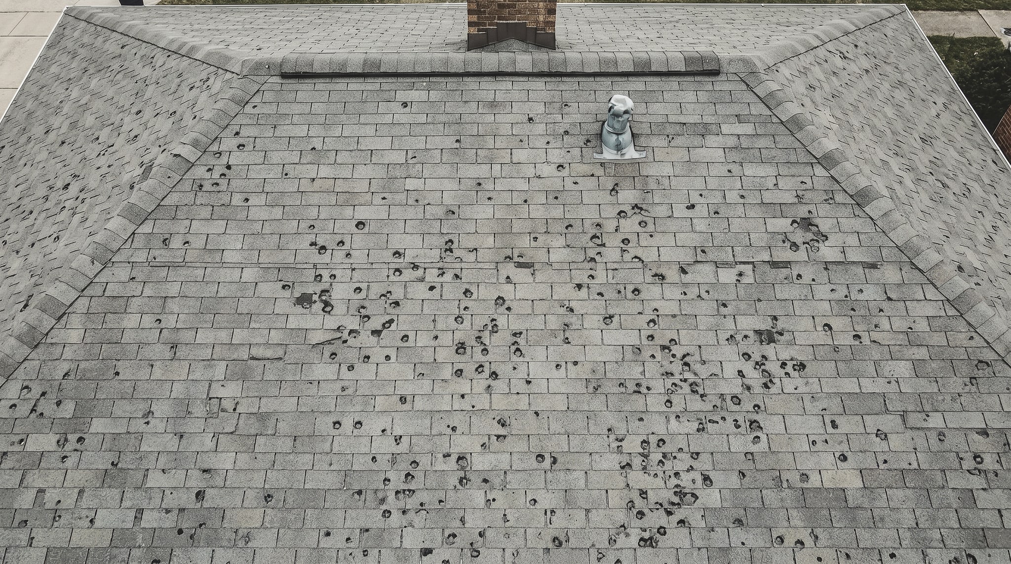 Storm-damaged roof before restoration